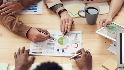 People aligning around shared planning material